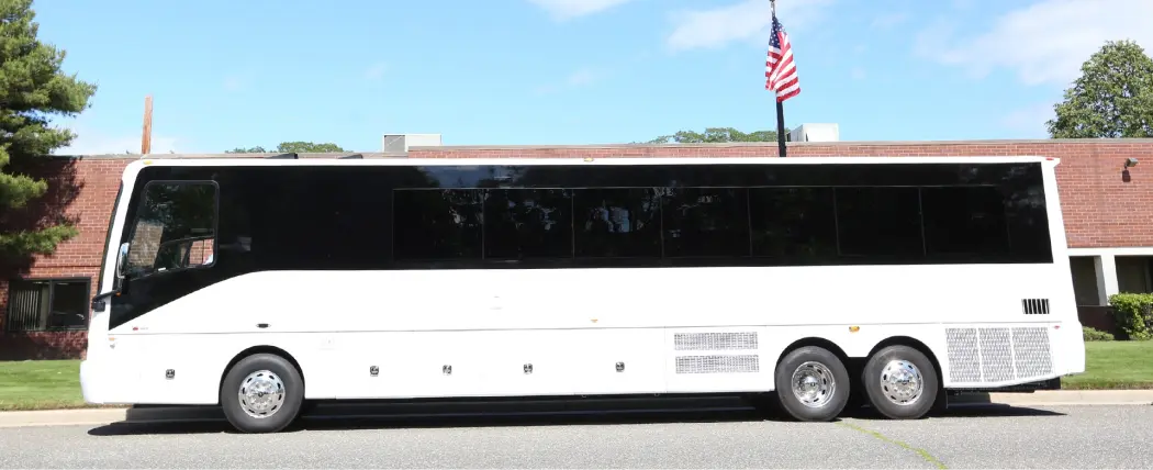 white 44 passenger party bus
