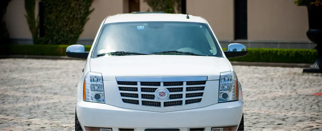 white cadillac escalade suv limo